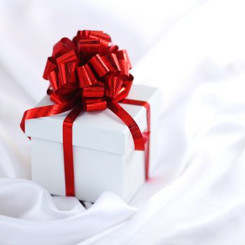  christmas gift on white silk background