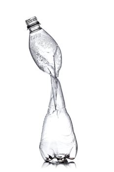smashed empty plastic bottle, isolated on white background