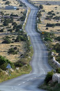Asphalt winding road, Island of Pag, Croatia.