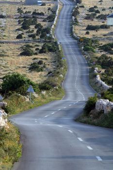 Asphalt winding road, Island of Pag, Croatia.