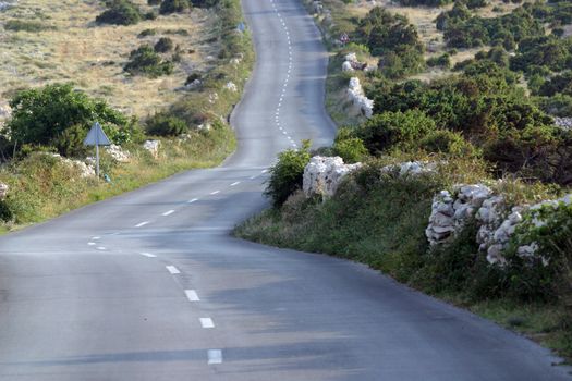Asphalt winding road, Island of Pag, Croatia.