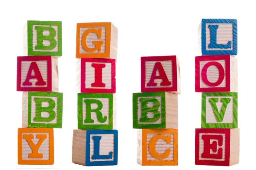 Four sets of isolated blocks spelling baby, girl, abc, love.