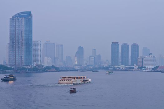 Chao Phraya river and city at twilight of Bangkok, Thailand