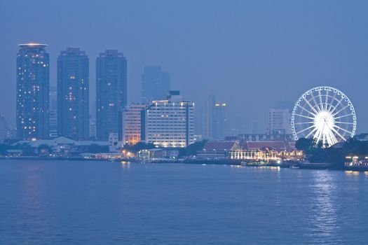 Ferris Wheel and night river in Bangkok, Thailand