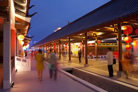 crowd walking in chinese ancient town at night