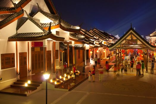 crowd walking in chinese ancient town at night