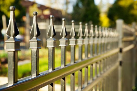 Pointed metal fence perspective with a narrow depth of field