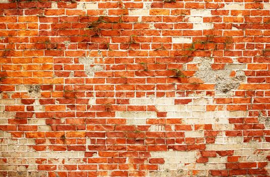 Weathered and cracked red Faux used brick wall