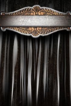 Metal on black silk curtain