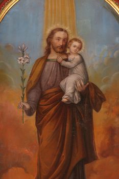 Saint Joseph holding baby Jesus