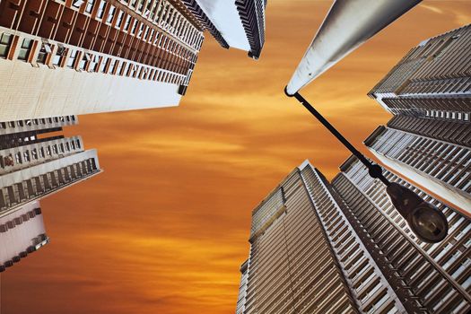 Cityscape photo of modern buildings in sunset in Hongkong