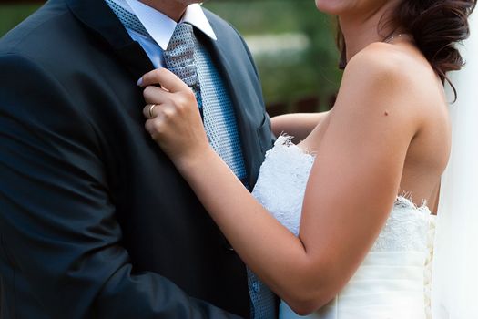 Bride and groom embrace each other on their wedding day