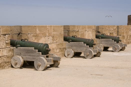 Cannons lining the battlements of the historic Moroccan fishing port of Essaouira in Morocco.