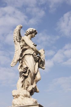 Statue of an Angel on the bridge (Pont Sant' Angelo) over the River Tiber in Rome, Italy.