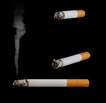 Set of cigarettes. Burning cigarettes with a smoke on a black background