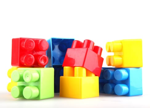 Plastic toy blocks on white background