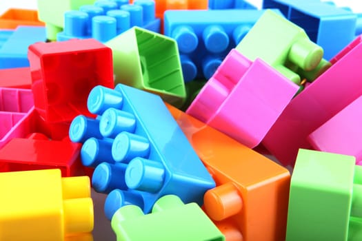 Plastic toy blocks on white background
