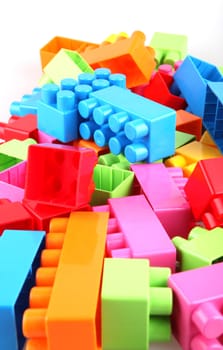Plastic toy blocks on white background