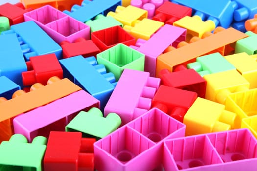 Plastic toy blocks on white background