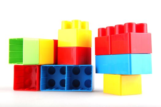 Plastic toy blocks on white background