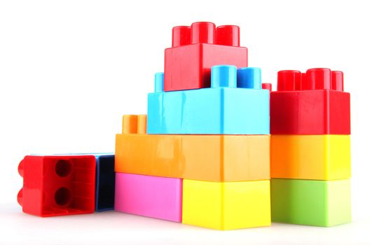 Plastic toy blocks on white background