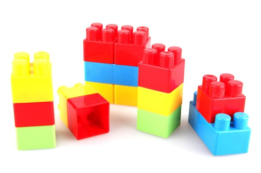 Plastic toy blocks on white background