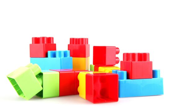 Plastic toy blocks on white background