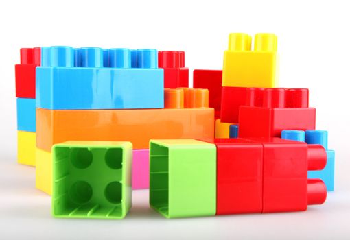 Plastic toy blocks on white background