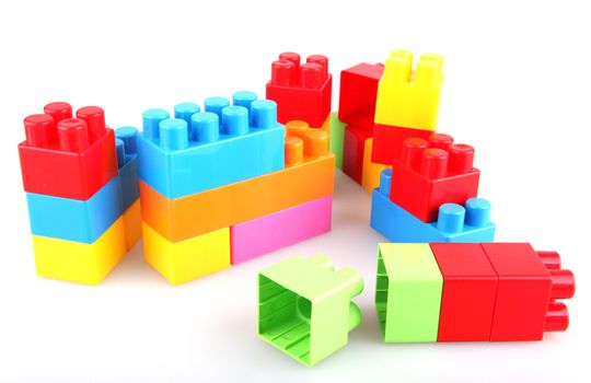 Plastic toy blocks on white background
