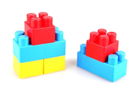 Plastic toy blocks on white background