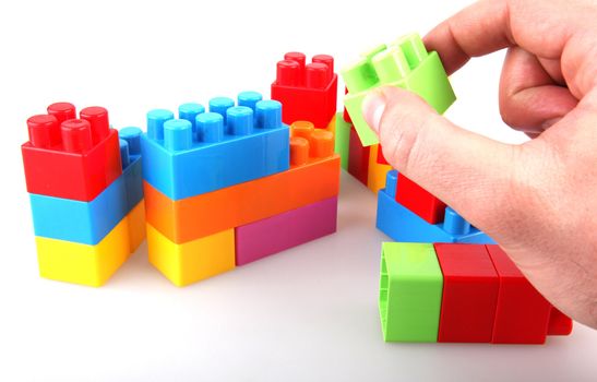 Plastic toy blocks on white background