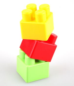 Plastic toy blocks on white background