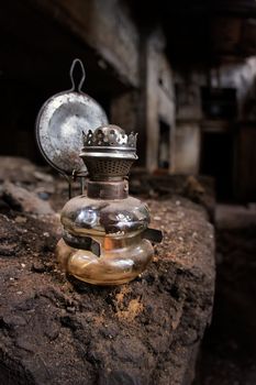 Old kerosene lamp in an abandoned, gloomy, creepy building of an old factory