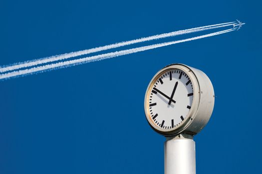 Time and speed. Clock and airplane