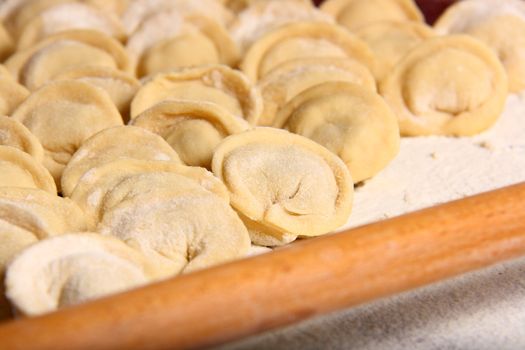 hand made ravioli getting prepared on table 