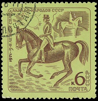 USSR - CIRCA 1971: stamp printed in USSR shows a rider on a horse, about 1971