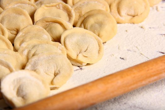 hand made ravioli getting prepared on table 