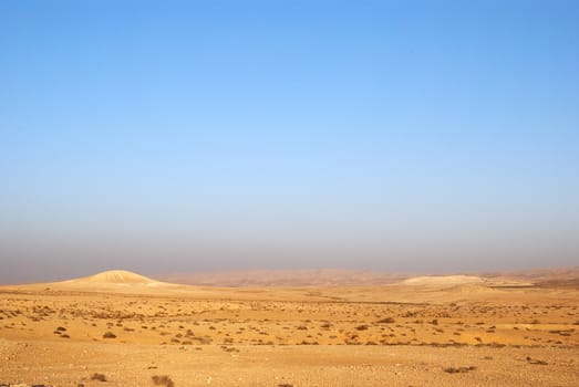 Fragment of Negev desert with mountains on a distance shot
