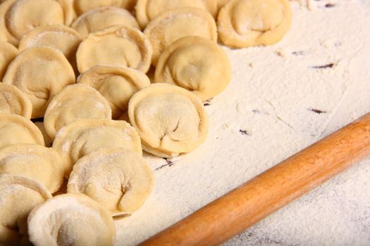 hand made ravioli getting prepared on table 