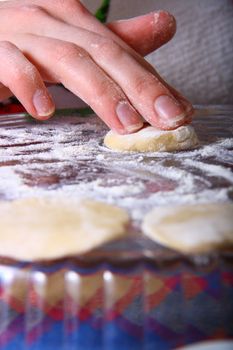 hand made ravioli getting prepared on table 