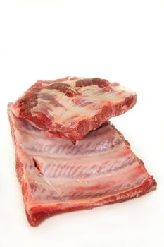 two pieces of spare ribs on a white background