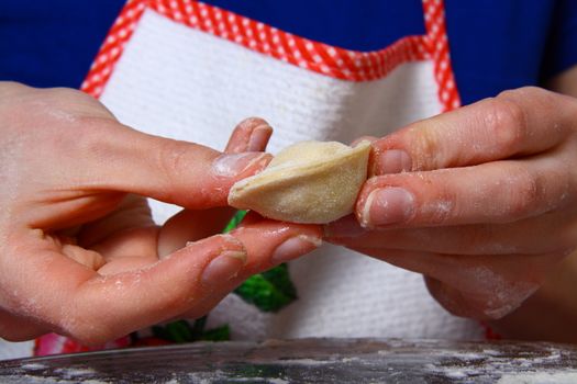 hand made ravioli getting prepared on table 