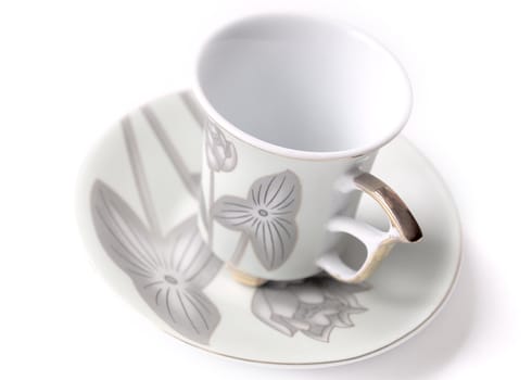 empty cup and saucer  with pattern  