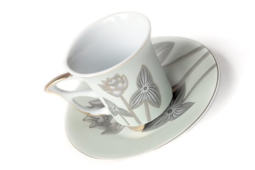 empty cup and saucer  with pattern  