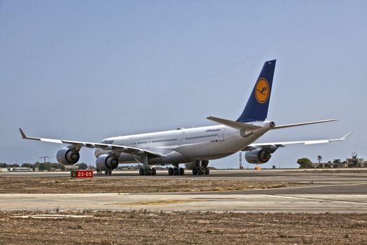 LUQA, MALTA - 25 SEP - Lufthansa A340 reg number D-AIHO rolls out of Lufthansa Technik hangar for trial flight on 25 September 2011