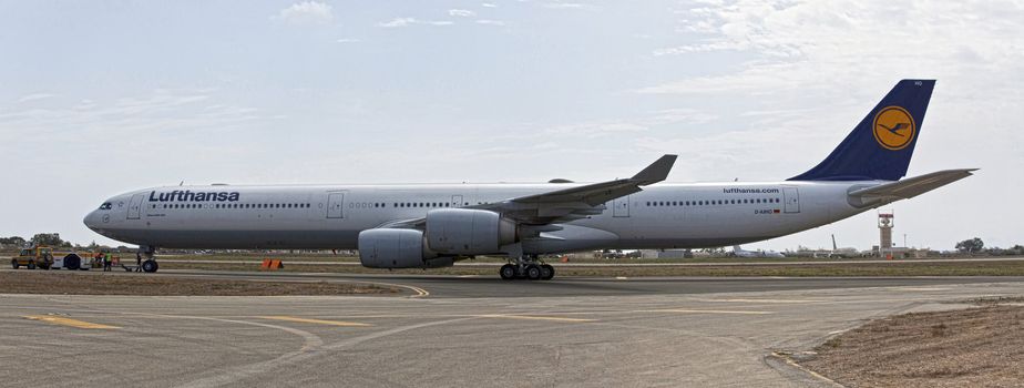 LUQA, MALTA - 25 SEP - Lufthansa A340 reg number D-AIHO rolls out of Lufthansa Technik hangar for trial flight on 25 September 2011