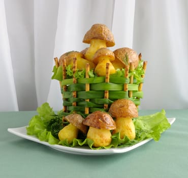 Mushrooms of potatoes (French fries) in a basket of green onions