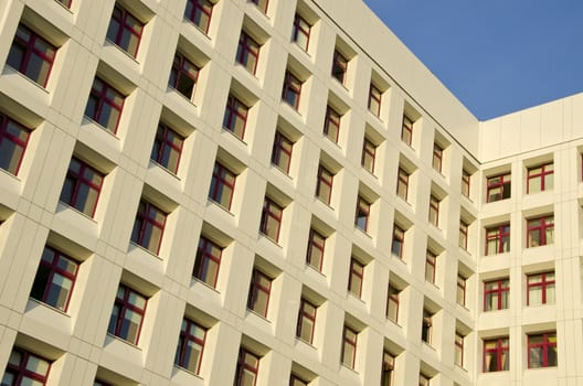 Detail of hospital building with many windows. Architectural backdrop.