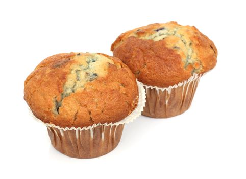 Two English blueberry muffins isolated over a white background.