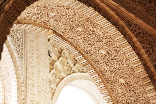 Closeup of arch in the Palacios Nazaries of the Alhambra of Granada, Spain.